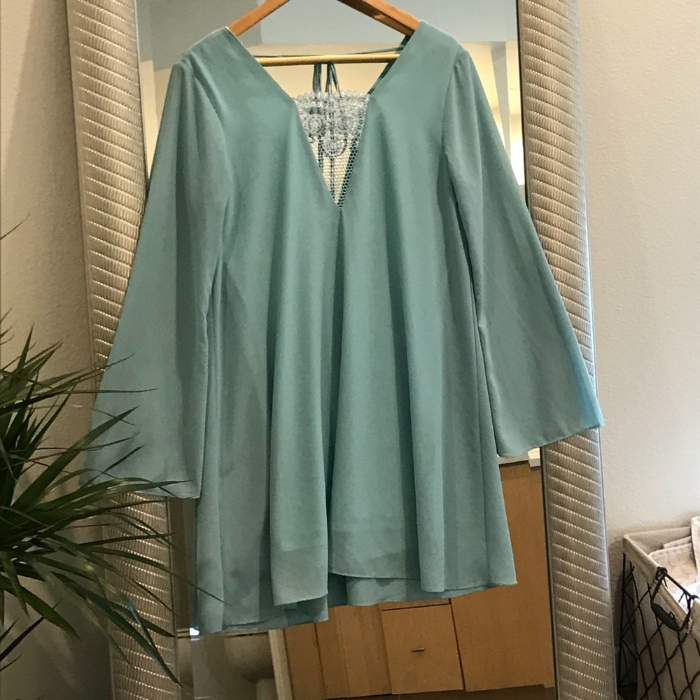 Long sleeved above the knee dress with lace detail